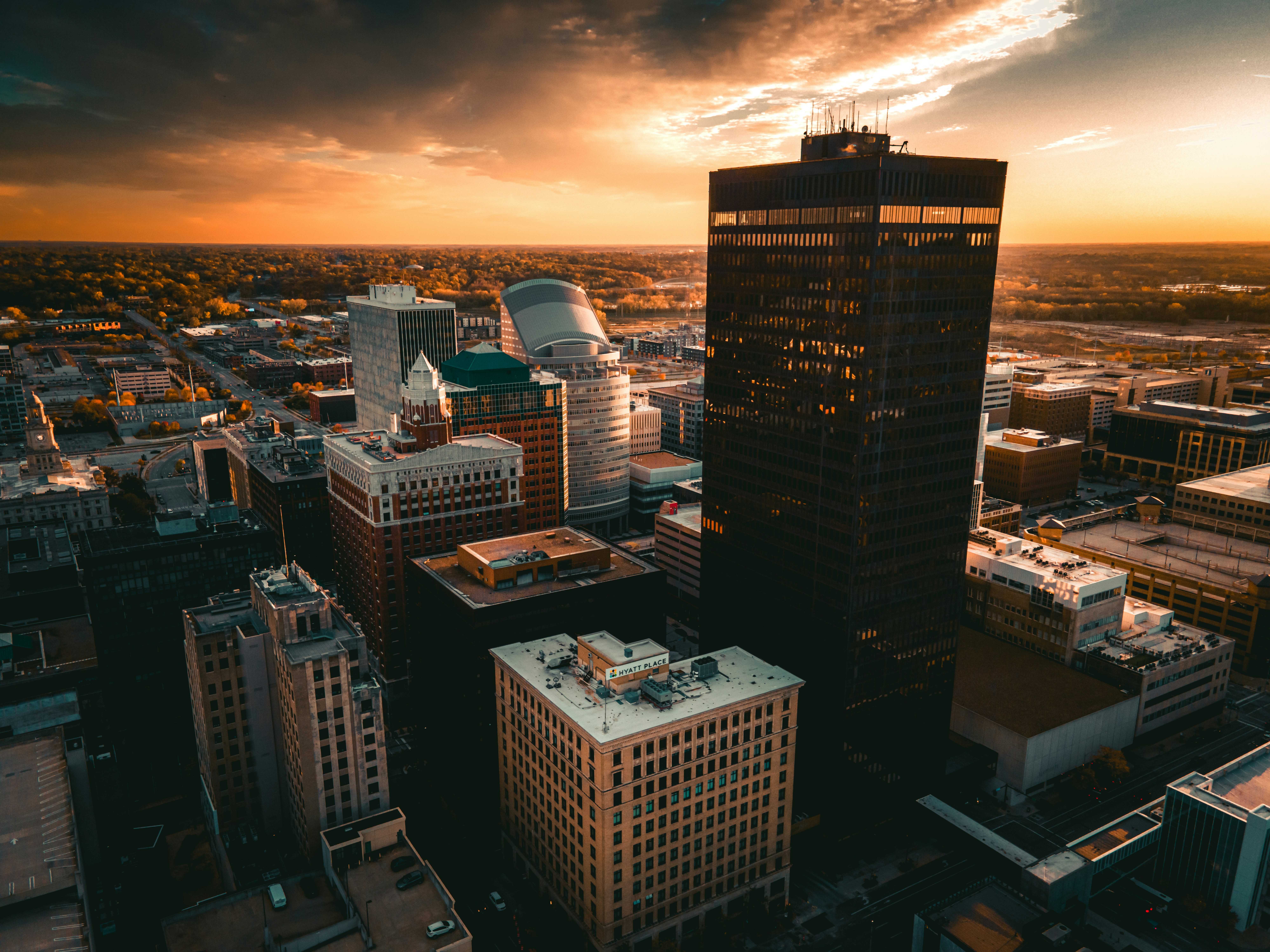 an aerial view of a city at sunset