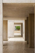 an empty room with wooden floors and walls