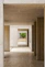 an empty room with wooden floors and walls