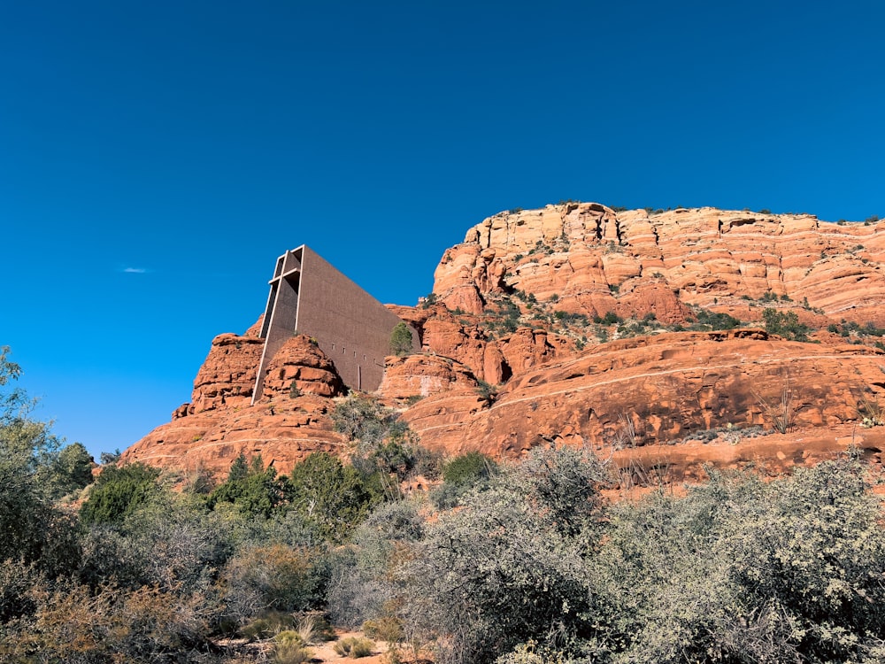 a very tall building sitting on top of a mountain