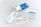 A collection of items related to a test kit, including a white and blue box labeled 'testalize.me', a sealed return envelope, a small vial, an information booklet, a code card, a pipette, and a clear plastic bag with a blue strip.