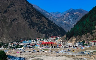 a village in a valley surrounded by mountains