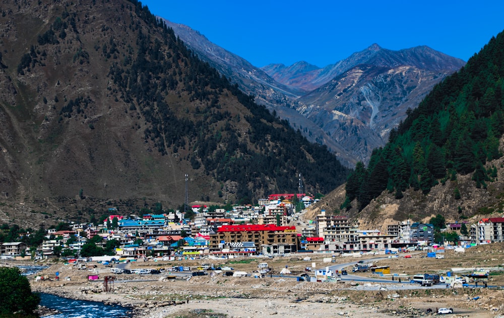 a village in a valley surrounded by mountains