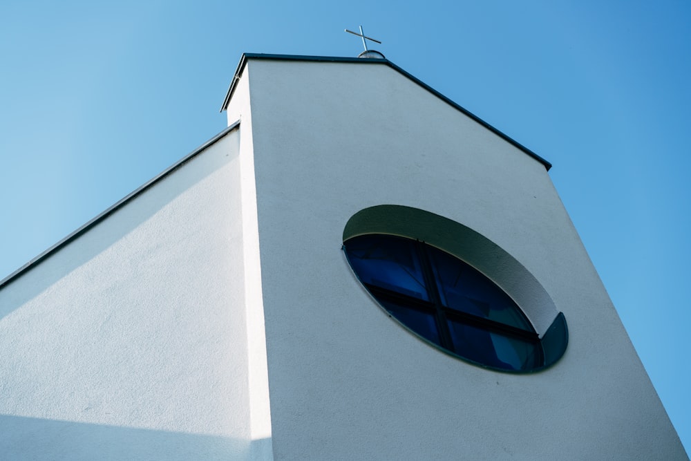 a church steeple with a cross on top of it