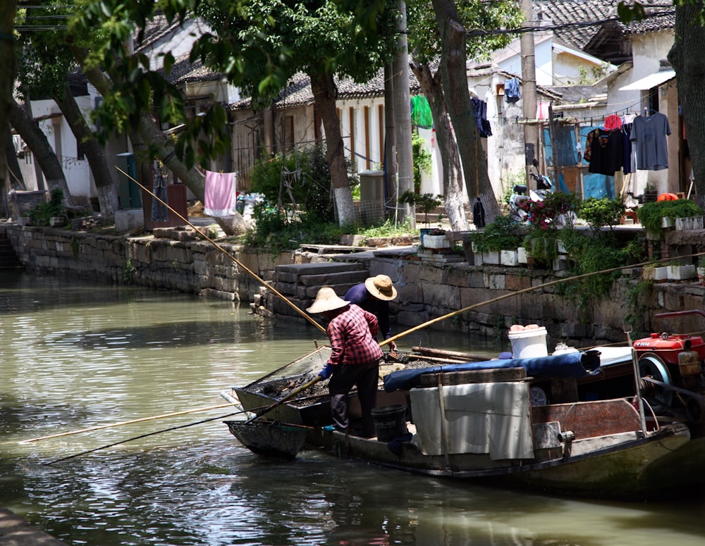 a person on a small boat in a body of water