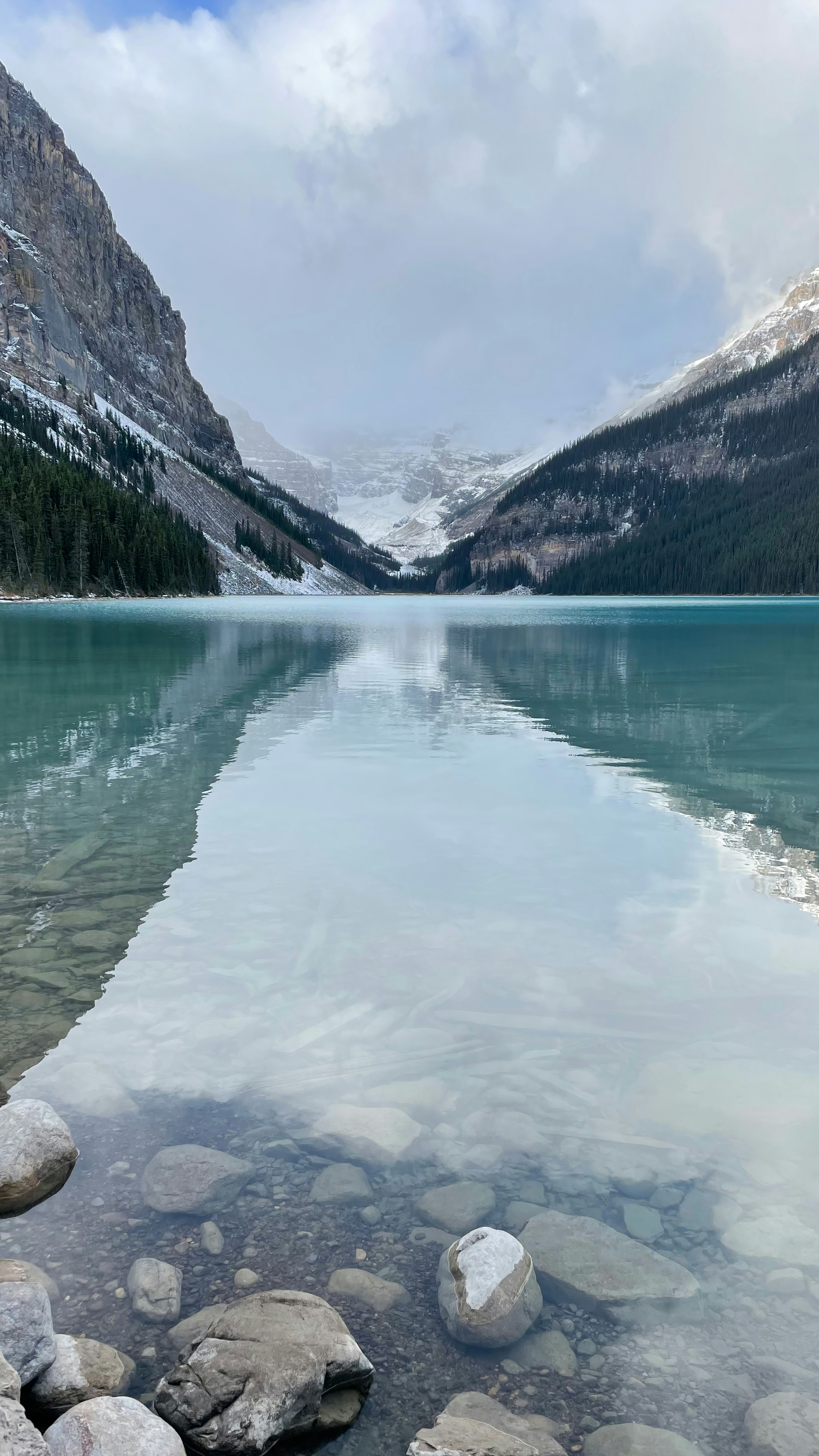 a body of water surrounded by mountains and rocks