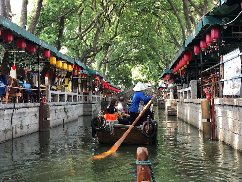 a person riding a boat down a river