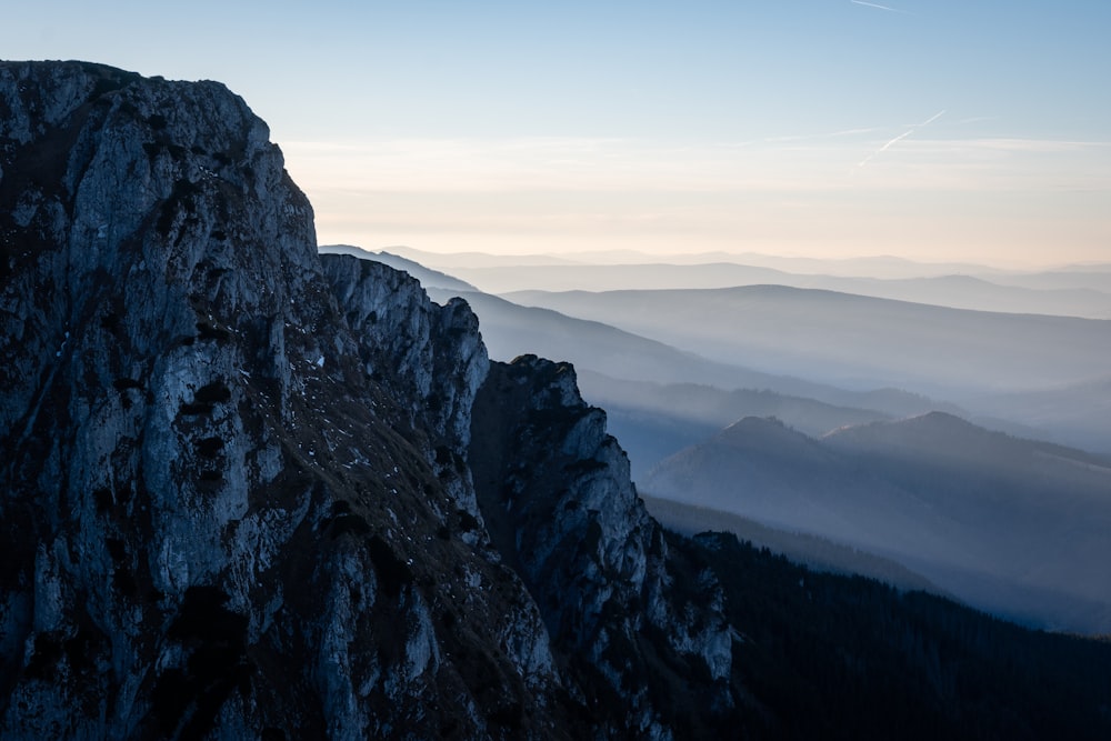 a person standing on top of a mountain