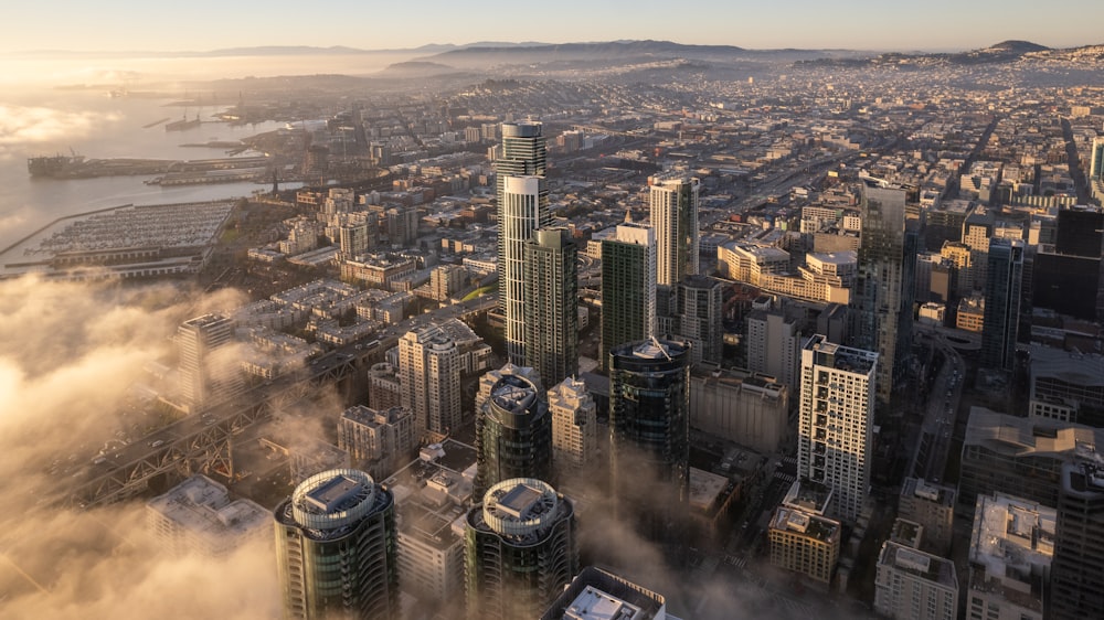 an aerial view of a city in the clouds