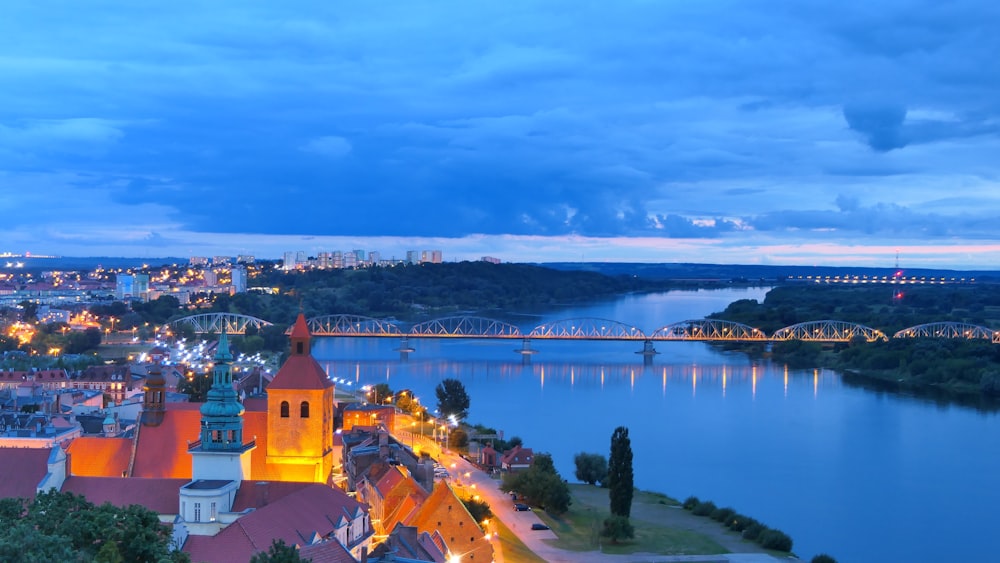 a view of a city and a river at night