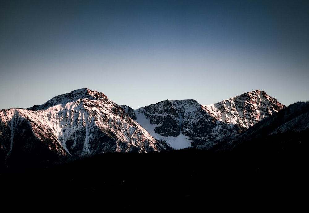 a view of a mountain range at sunset