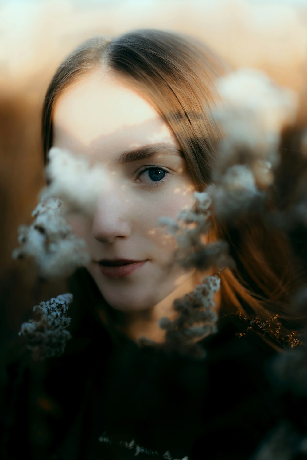 a woman with long hair and blue eyes