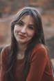 a close up of a person with long hair