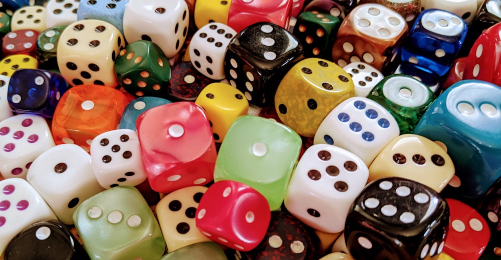a pile of colorful dices sitting on top of each other