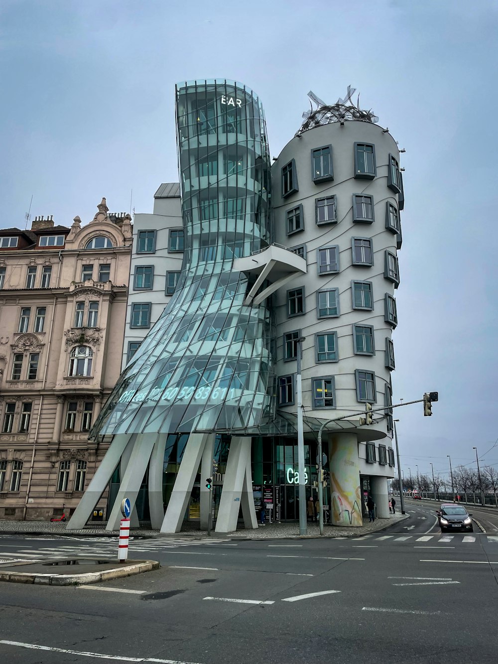 a very tall building with a curved glass front