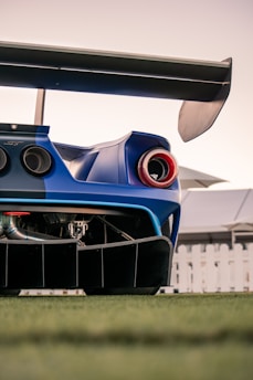 the rear end of a blue sports car