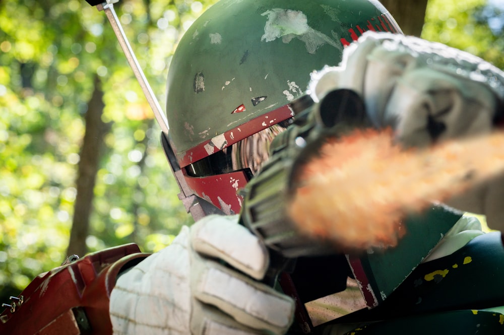 a person wearing a helmet and holding a baseball bat