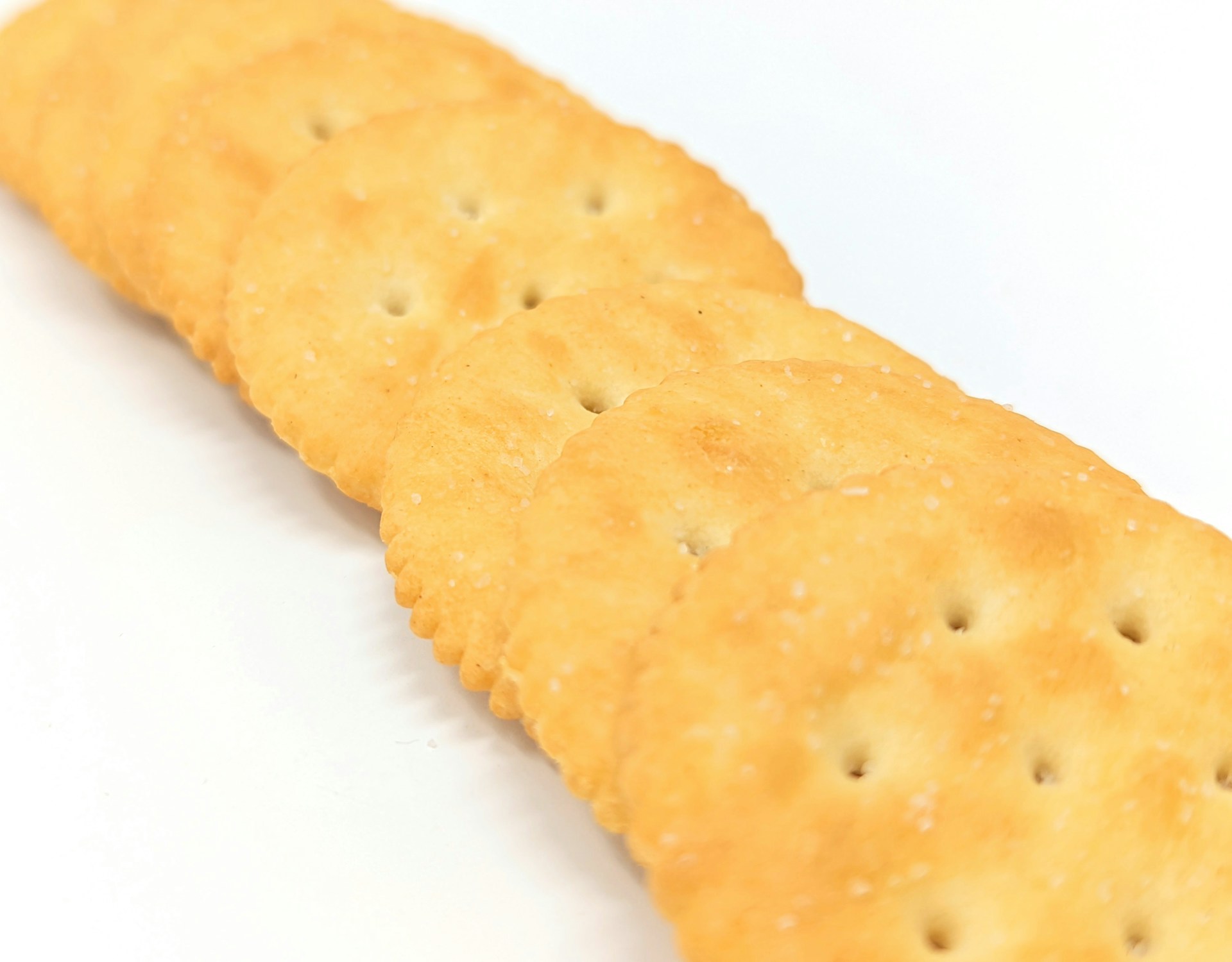 a close up of a cracker on a white surface