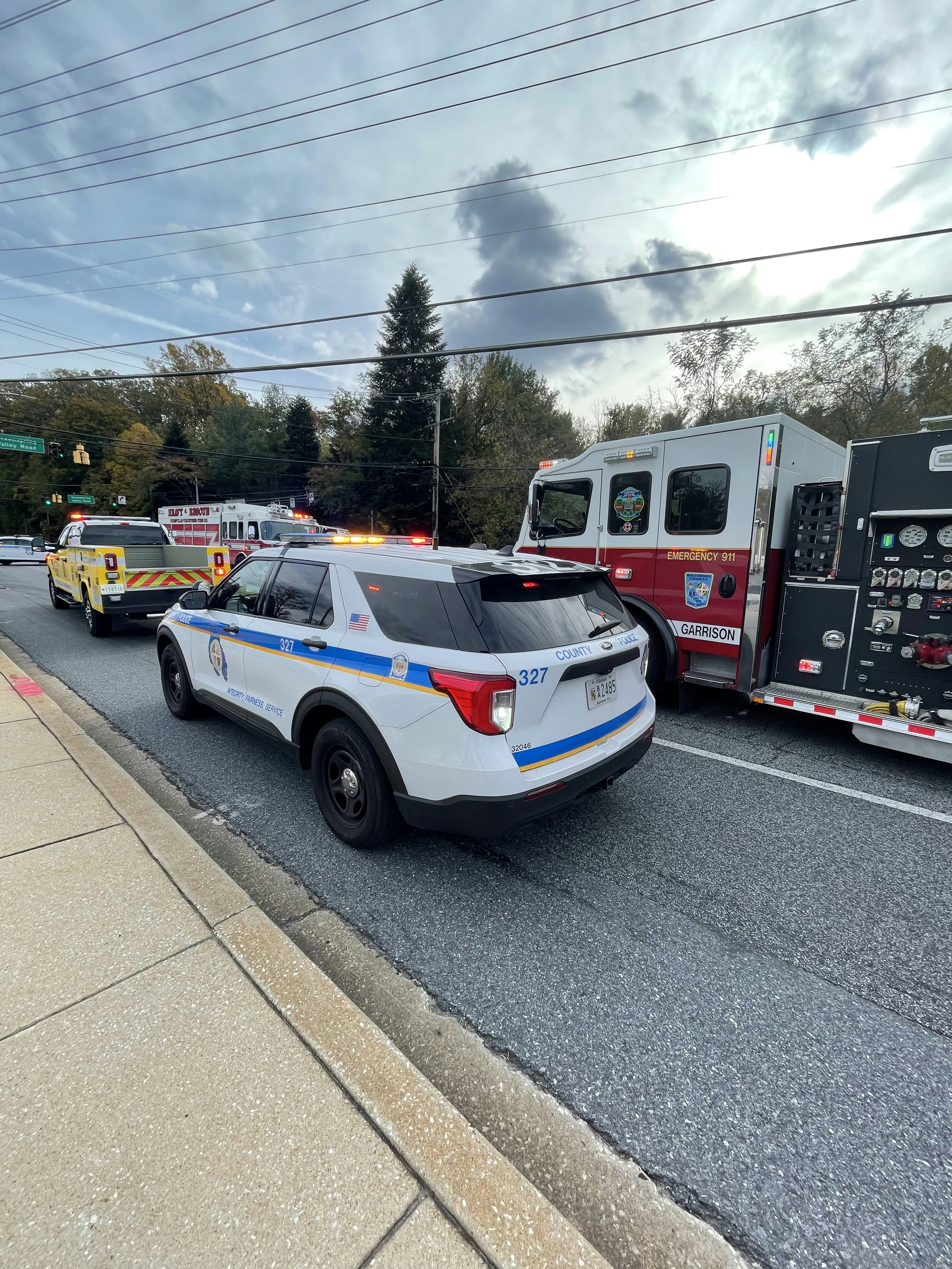 a police car is parked next to a fire truck