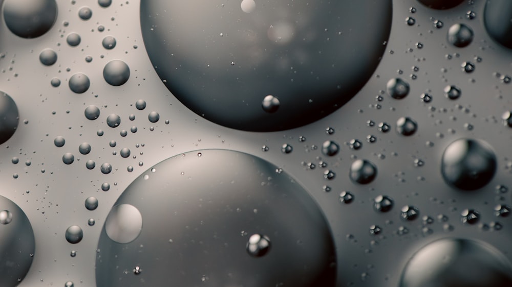 a close up of water droplets on a surface