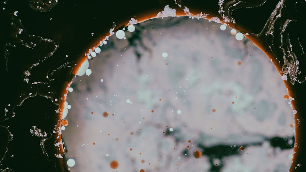 a close up of a circular object with bubbles