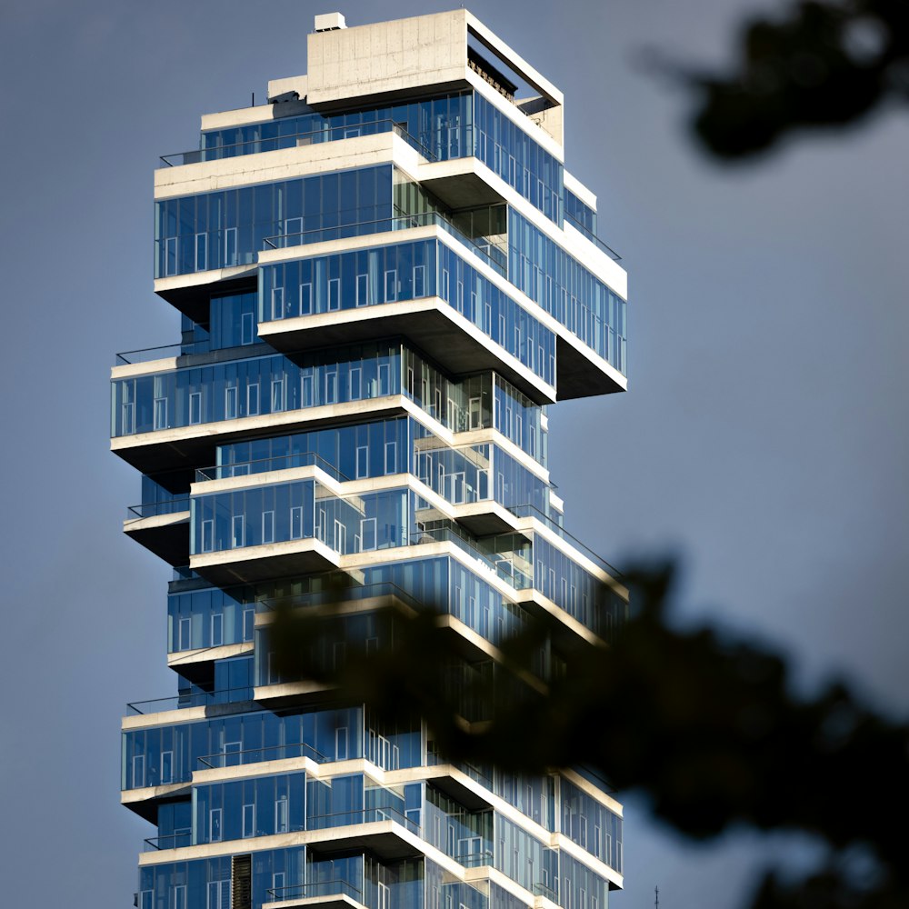 a tall building with balconies on top of it