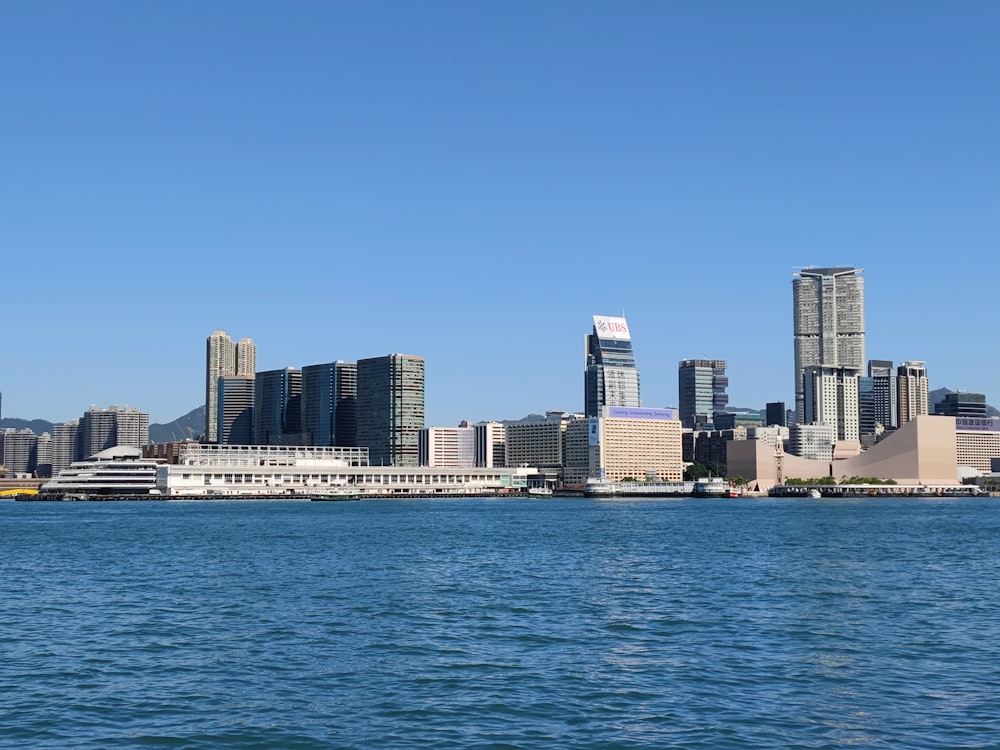 a large body of water with a city in the background