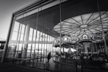 a black and white photo of a merry go round