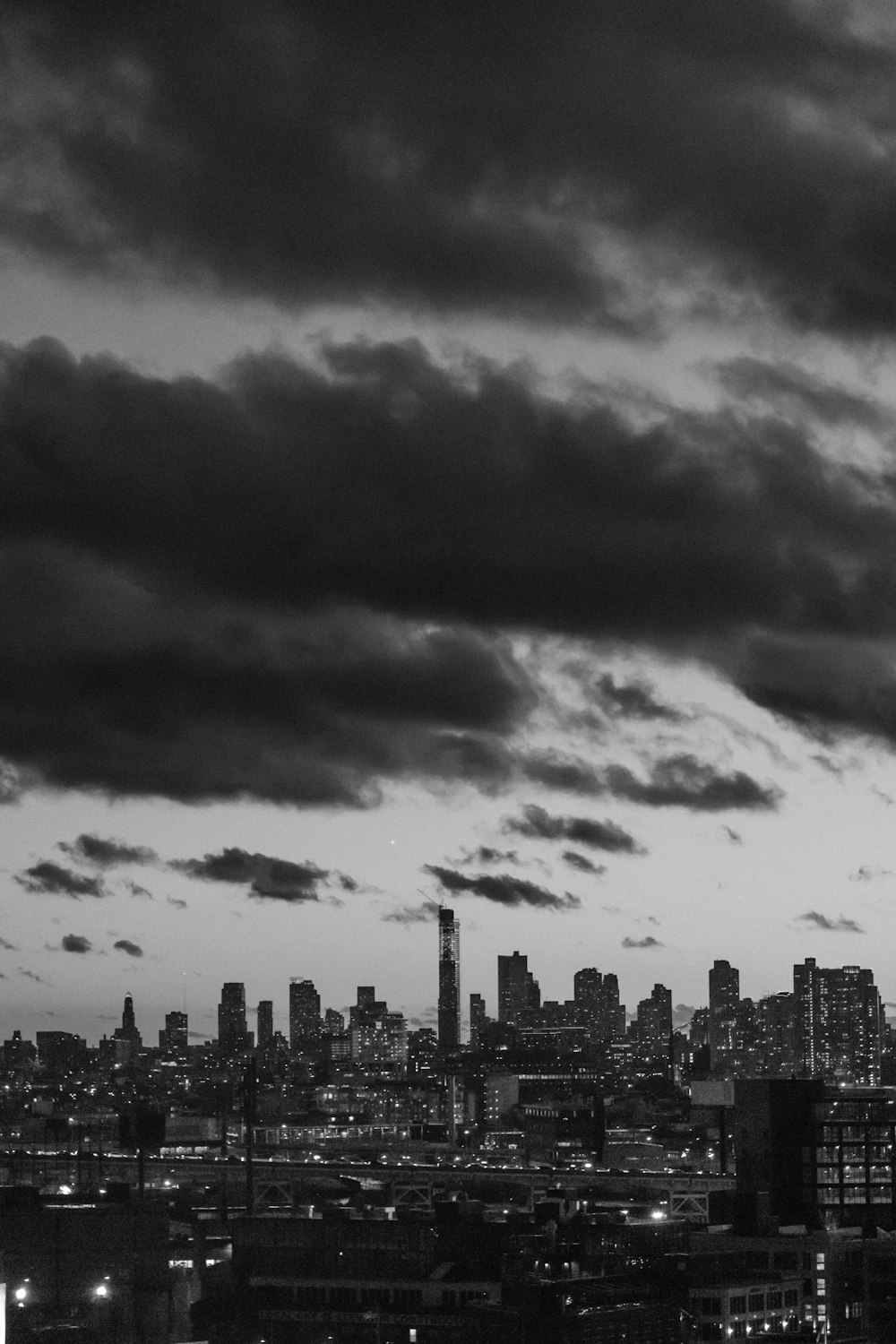 a black and white photo of a city at night