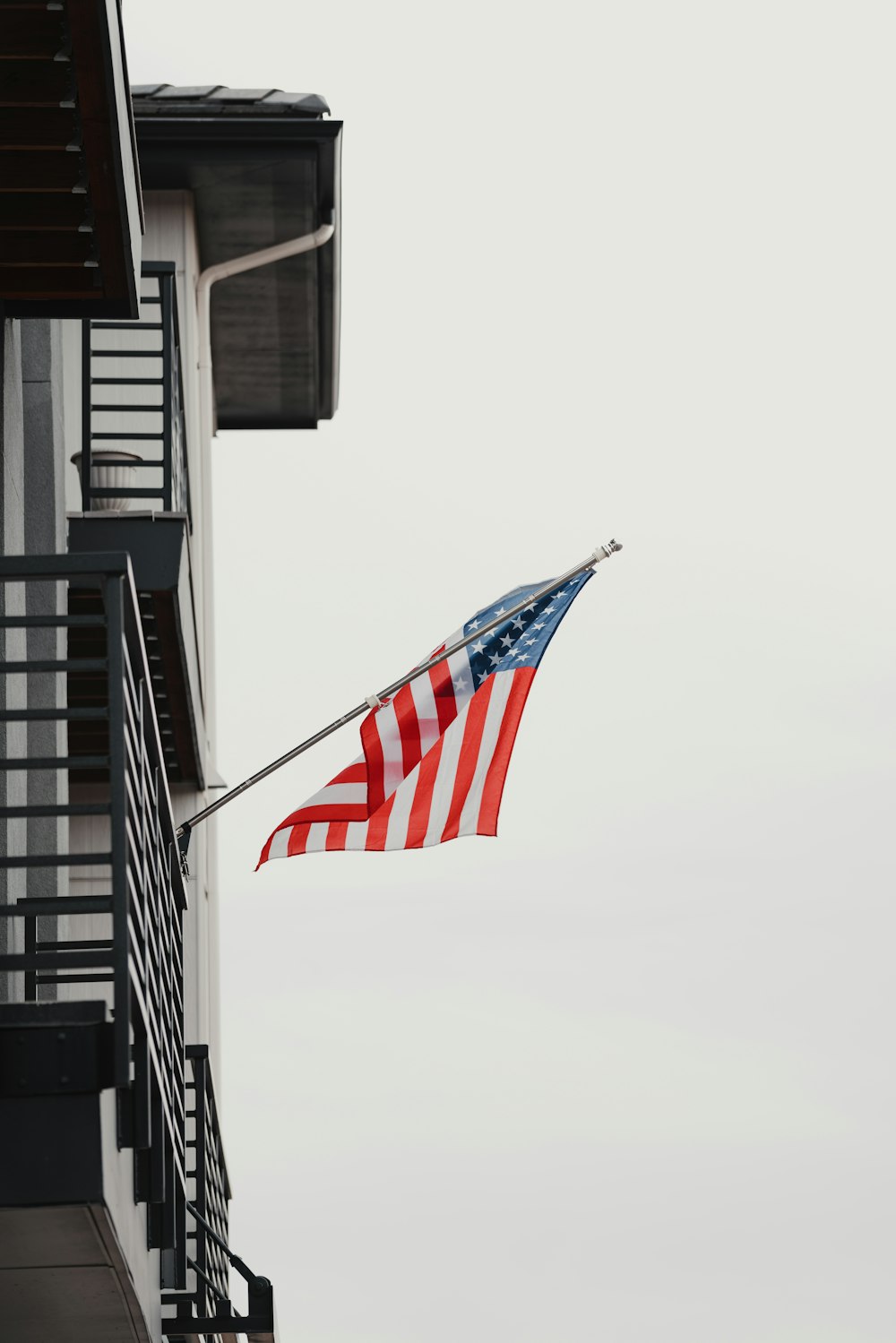 an american flag flying in front of a building