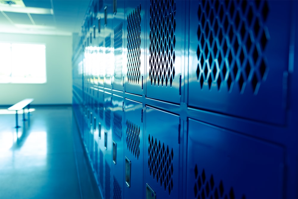 a row of blue lockers in a room