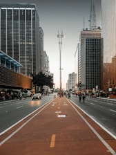 a city street lined with tall buildings and tall skyscrapers