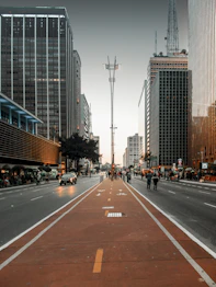 a city street lined with tall buildings and tall skyscrapers