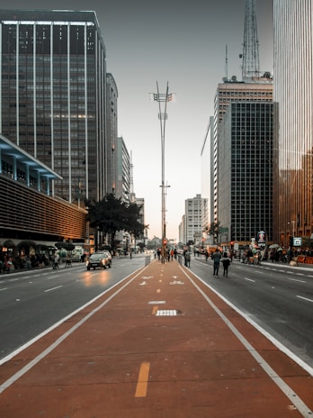 a city street lined with tall buildings and tall skyscrapers