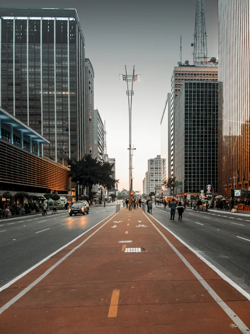 a city street lined with tall buildings and tall skyscrapers