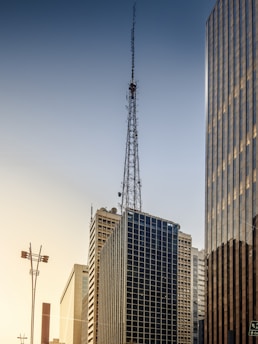 a tall building with a radio tower on top of it