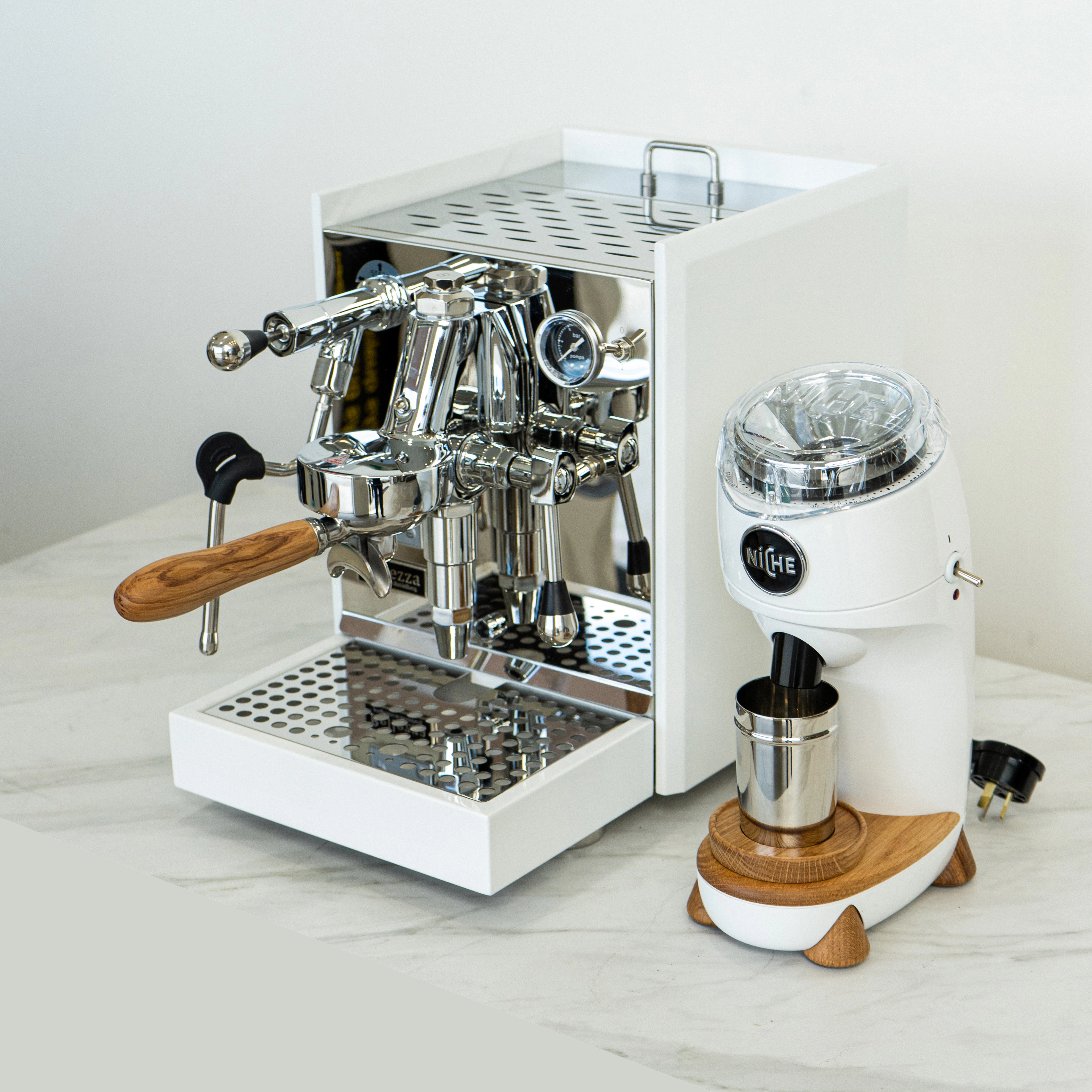 A coffee machine sitting on top of a white counter