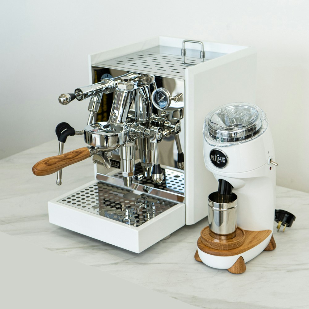 a coffee machine sitting on top of a white counter