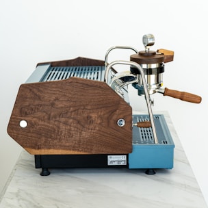 an espresso machine sitting on top of a marble counter
