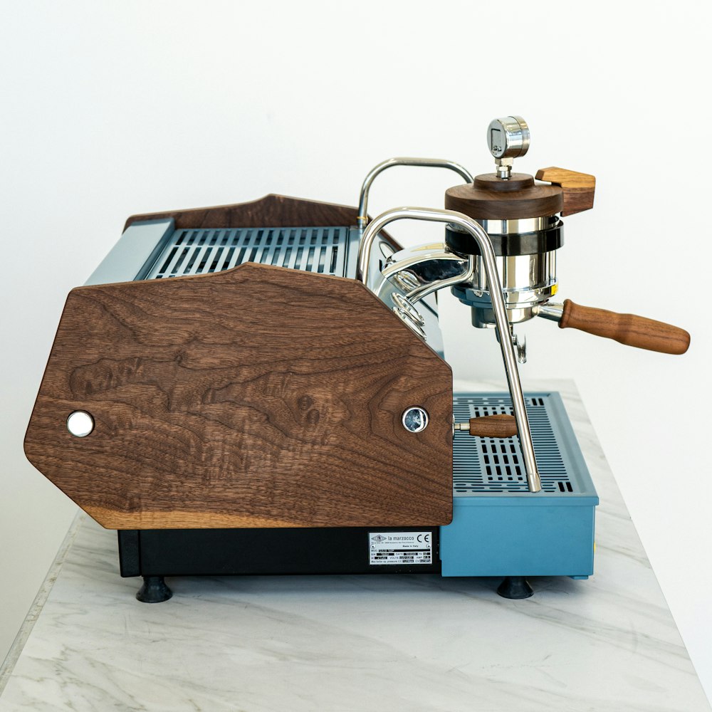 an espresso machine sitting on top of a marble counter