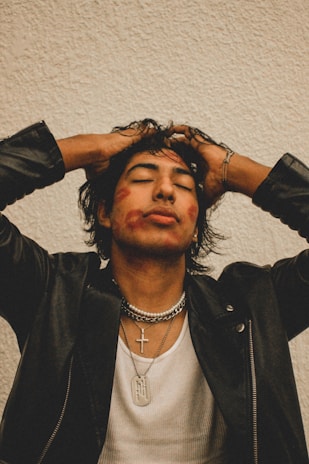 a man with his hands on his head