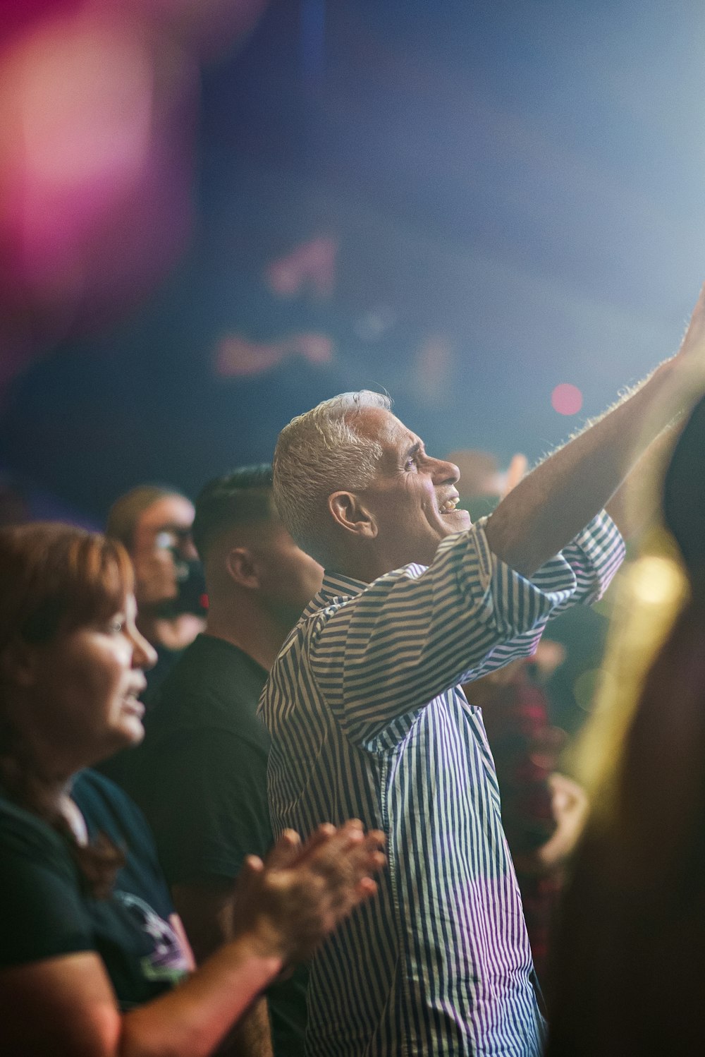 a man standing in front of a crowd of people