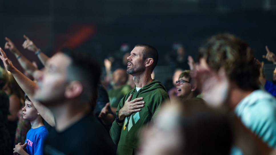 a man standing in front of a crowd of people