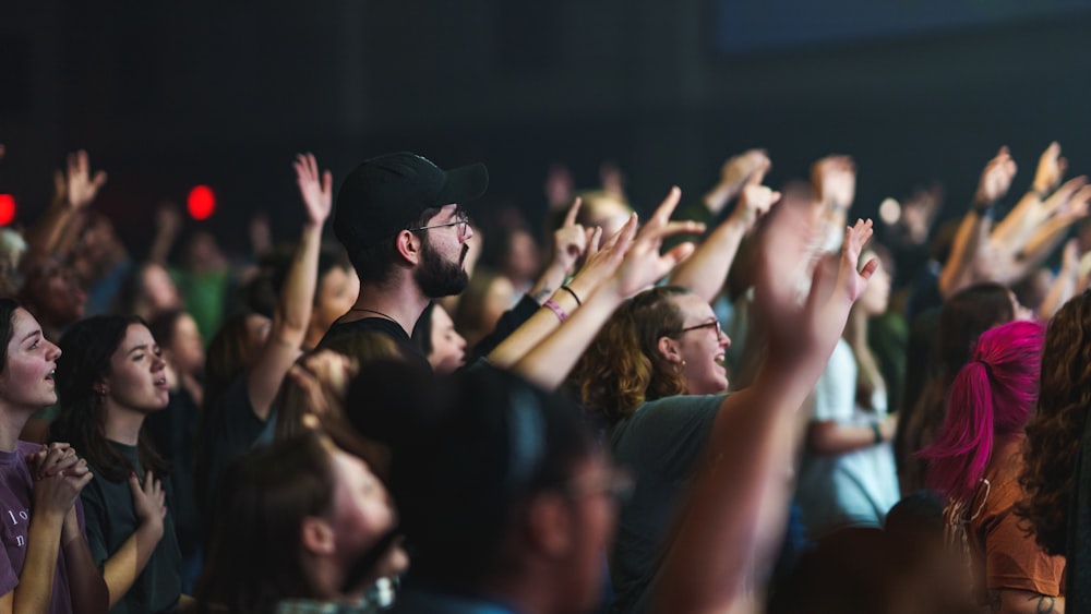 a group of people standing in front of a crowd