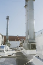 a large white building with a lot of smoke coming out of it