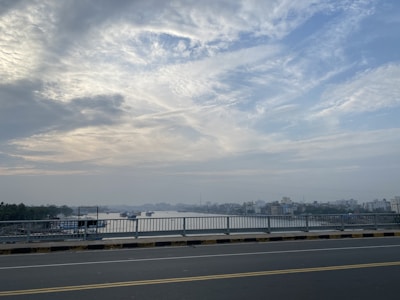 A serene view of the Rio de Janeiro skyline with a river in the foreground.