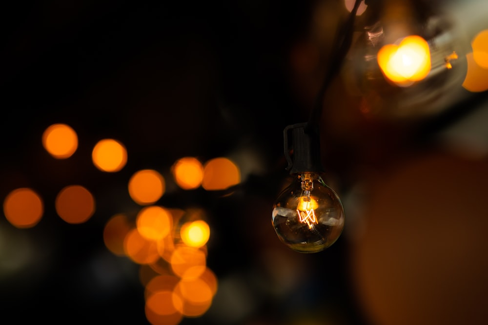 a close up of a light bulb in a dark room