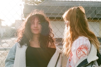 a couple of women standing next to each other