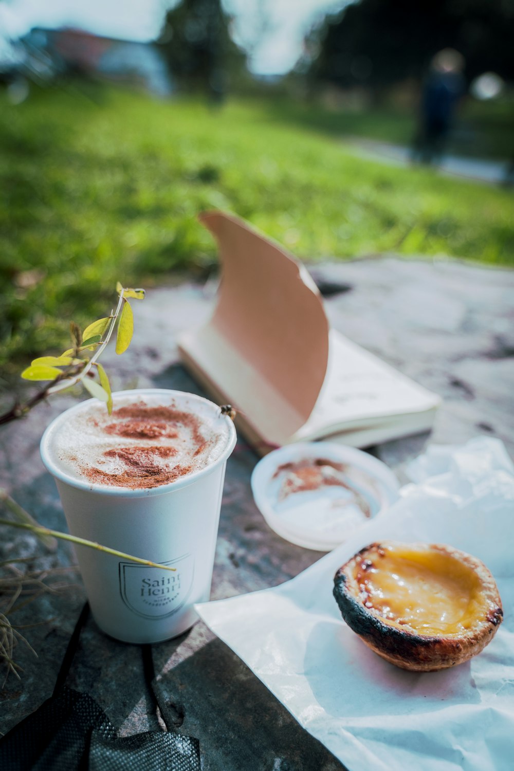 a cup of coffee sitting on top of a table