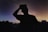 A serene image of a person gazing at the stars in a night sky, symbolizing reflection and guidance.